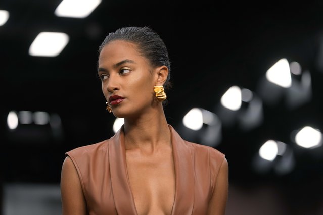 A model wears a creation as part of the Ferrari Spring Summer 2025 collection, that was presented in Milan, Italy, Saturday, September 21, 2024. (Photo by Luca Bruno/AP Photo).