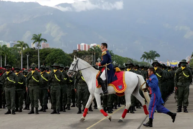 Venezuela's soldiers participate in a military parade to celebrate the 195th anniversary of the Battle of Carabobo in Caracas, Venezuela June 24, 2016. (Photo by Marco Bello/Reuters)