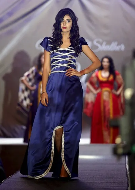 A model presents a creation by Iraqi designer Waffa Al-Shathar during a fashion show at the Hunting Club in Baghdad August 13, 2015. (Photo by Thaier al-Sudani/Reuters)