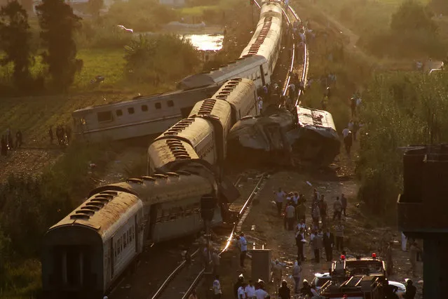 Two trains are seen after they collided just outside Egypt's Mediterranean port city of Alexandria, Friday, August 11, 2017, killing at least dozens of people and injuring over 100 in the country's deadliest rail accident in more than a decade. (Photo by Ravy Shaker/AP Photo)