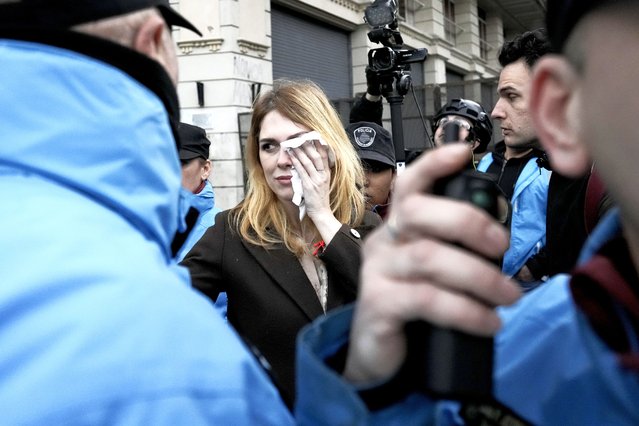 LIlia Lemoine, a candidate for Argentina's lower house of Congress for the Liberty Advances party led by Javier Milei, covers her eye after an alleged attack by protesters outside the Buenos Aires City Legislature in Buenos Aires, Argentina, Monday, September 4, 2023. Demonstrators protested an event organized by Milei's running mate Victoria Villarruel to honor victims of armed 1970's leftist groups. (Photo by Rodrigo Abd/AP Photo)