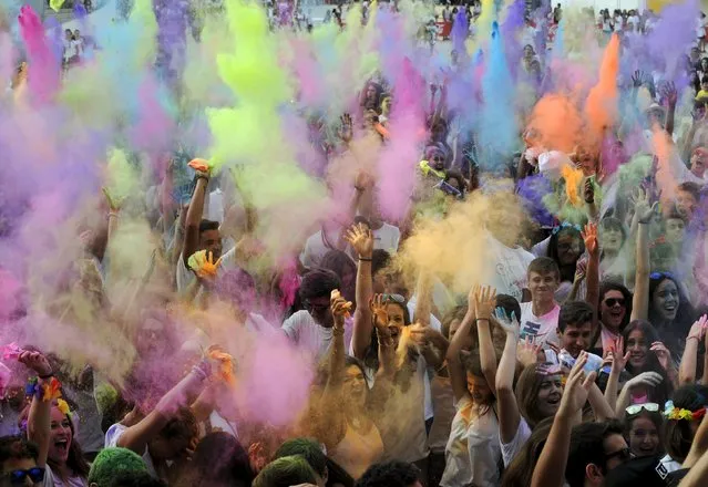 Revellers take part in the Holi Party Festival at the Niemeyer Center in Aviles, northern Spain, August 29, 2015. (Photo by Eloy Alonso/Reuters)