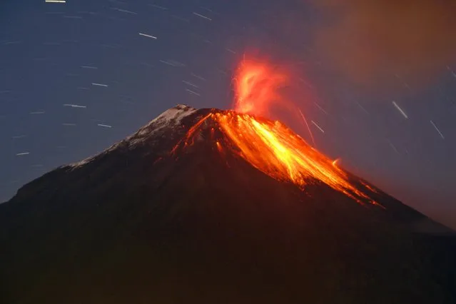 Tungurahua volcano erupts near Banos August 31, 2014. Tungurahua, which means “Throat of Fire” in the local Quechua language, has been classified as active since 1999. (Photo by Carlos Campania/Reuters)