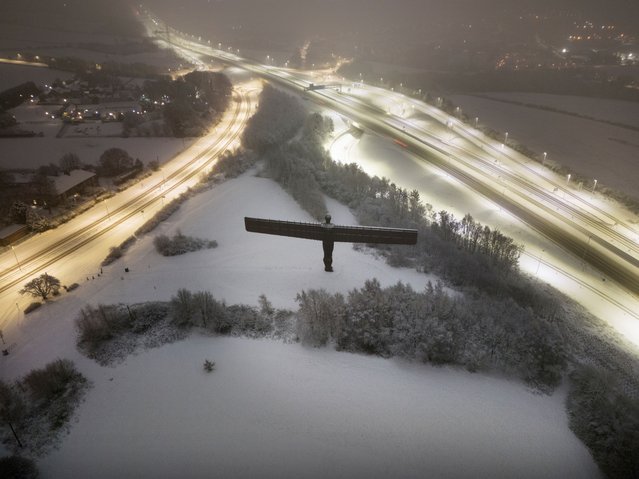 Snow surrounds the Angel of the North in Gateshead, Tyne and Wear on Sunday, January 5, 2025. Heavy overnight snow is causing disruption across the UK as the cold start to the new year continues. (Photo by Owen Humphreys/PA Images via Getty Images)