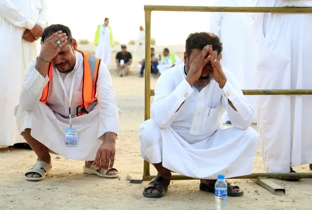 Mourners react during the funeral of policeman Ali al-Habib, who was killed in Friday's attack on a security facility in Saudi Arabia's Eastern Province, in Abqaiq city September 6, 2015. Saudi Arabian security forces killed what they called “a terrorist” who attempted to attack the security facility in the country's oil-producing Eastern Province, state television reported on Friday. (Photo by Ali Al Dhaif/Reuters)