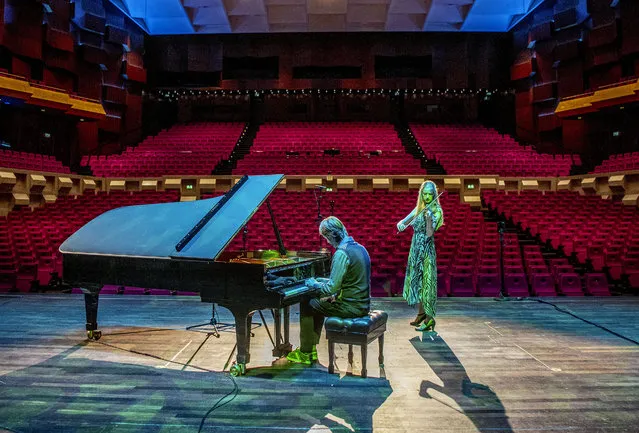 Musicians Merel Vercammen and Rembrandt Frerichs perform in an empty hall of De Doelen theater in Rotterdam, Netherlands on May 7, 2020. One third of the Dutch theater and concert stages that have missed out on turnover since the corona virus is in danger of reaching the summer. (Photo by Robin Utrecht/Rex Features/Shutterstock)