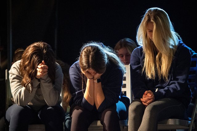 Members of the community mourn together at Bridgewood Church in Clarkston, Michigan, a day after a 15-year-old student killed four classmates before surrendering to police at Oxford, High School in Oxford, Michigan, USA, 01 December 2021. The Oakland County Sheriff stated that in additional to the four killed, six other students and a teacher were wounded with a handgun investigators believe was purchased by the suspect's father a few days ago. (Photo by Nic Antaya/EPA/EFE)