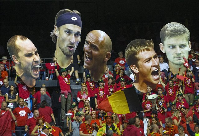 Fans hold up giant portraits of Belgium's Davis Cup team (from L to R) Steve Darcis, Ruben Bemelmans, captain Johan Van Herck, Kimmer Coppejans and David Goffin during their semi-final match of the Davis Cup against Argentina at Forest National arena in Brussels, Belgium September 18, 2015. (Photo by Yves Herman/Reuters)