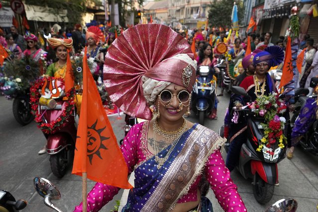 Women dressed in traditional attire participate in a procession to mark Gudi Padwa or the Marathi New Year in Mumbai, India, Sunday, March 30, 2025. (Photo by Rajanish Kakade/AP Photo)