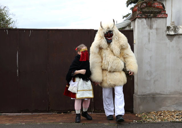 Revellers wear masks during the traditional Buso Carnival in Mohacs, Hungary, on February 11, 2024. (Photo by Bernadett Szabo/Reuters)