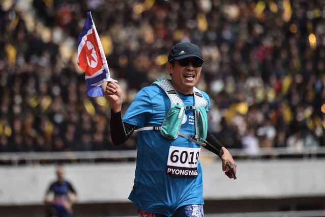 A participant takes part in the 31st Pyongyang International Marathon at Kim Il Sung Stadium in Pyongyang on April 6, 2025, as part of celebrations marking the birth of North Korea's founding leader Kim Il Sung in 1912. (Photo by Kim Won Jin/AFP Photo)