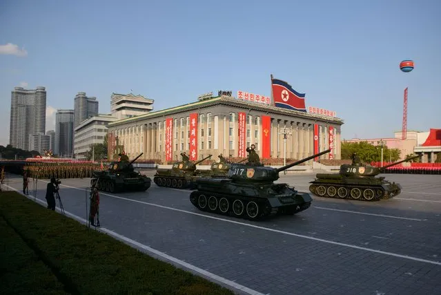 North Korean military vehicles pass through Kim Il-Sung square during a mass military parade in Pyongyang on October 10, 2015. North Korea was marking the 70th anniversary of its ruling Workers' Party. (Photo by Ed Jones/AFP Photo)