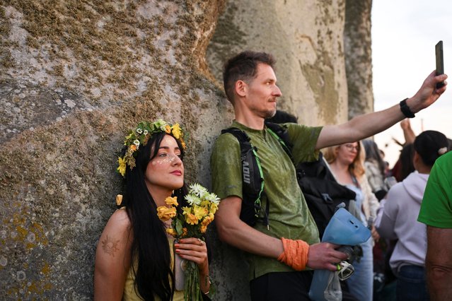 Revellers attend summer solstice celebrations during sunrise at Stonehenge near Amesbury, Britain, on June 21, 2025. (Photo by Jaimi Joy/Reuters)