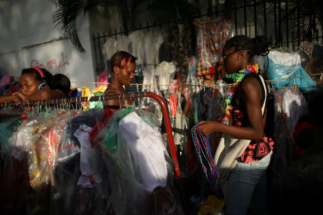 Women look for goods at stands with costumes in Port-au-Prince, Haiti February 7, 2018. (Photo by Andres Martinez Casares/Reuters)