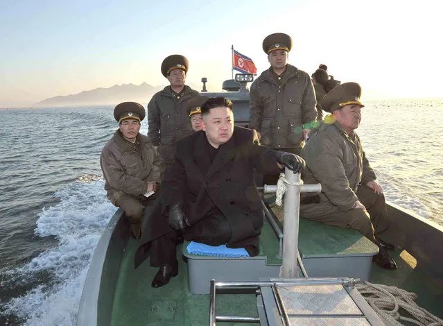 In this March 11, 2013 photo released by the Korean Central News Agency (KCNA) and distributed March 12, 2013 by the Korea News Service, North Korean leader Kim Jong Un rides on a boat, heading for the Wolnae Islet Defense Detachment, North Korea, near the western sea border with South Korea. North Korea's young leader urged front-line troops to be on “maximum alert” for a potential war as a state-run newspaper said Pyongyang had carried out a threat to cancel the 1953 armistice that ended the Korean War. (Photo by AP Photo/KCNA via KNS)