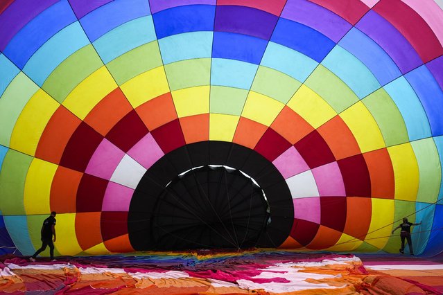 Preparations underway for the opening event of the 29th European Balloon Festival in the town of Igualada, Barcelona, northeastern Spain, 10 July 2025. (Photo by Enric Fontcuberta/EPA)