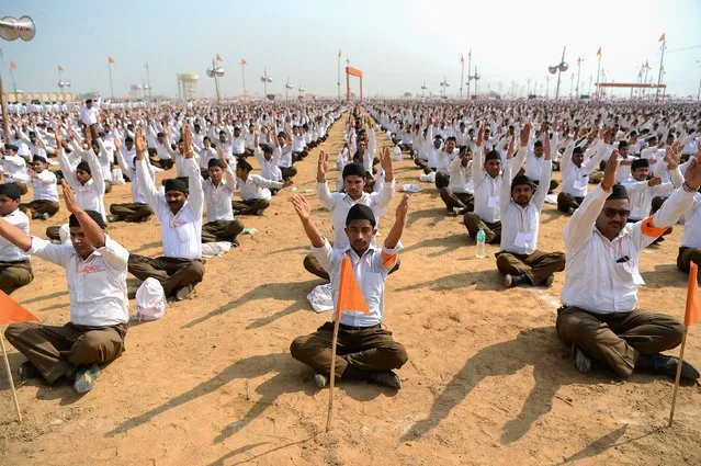 Indian volunteers of the right-wing Hindu nationalist group Rashtriya Swayamsevak Sangh (RSS) gather for a large-scale congregation in Meerut on February 25, 2018. Over 200,000 RSS volunteers from district groups in Uttarakhand and Uttar Pradesh states were set to attend the RSS's “Rashtrodaya Sammelan” congregation in Meerut. (Photo by Sajjad Hussain/AFP Photo)