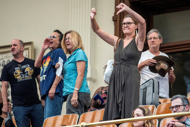 Protesters shout "cheaters" and gesture as the House of Representatives adjourns after Democratic lawmakers left the state to deny Republicans the opportunity to redraw the state's 38 congressional districts, in Austin, Texas on August 11, 2025. (Photo by Sergio Flores/Reuters)