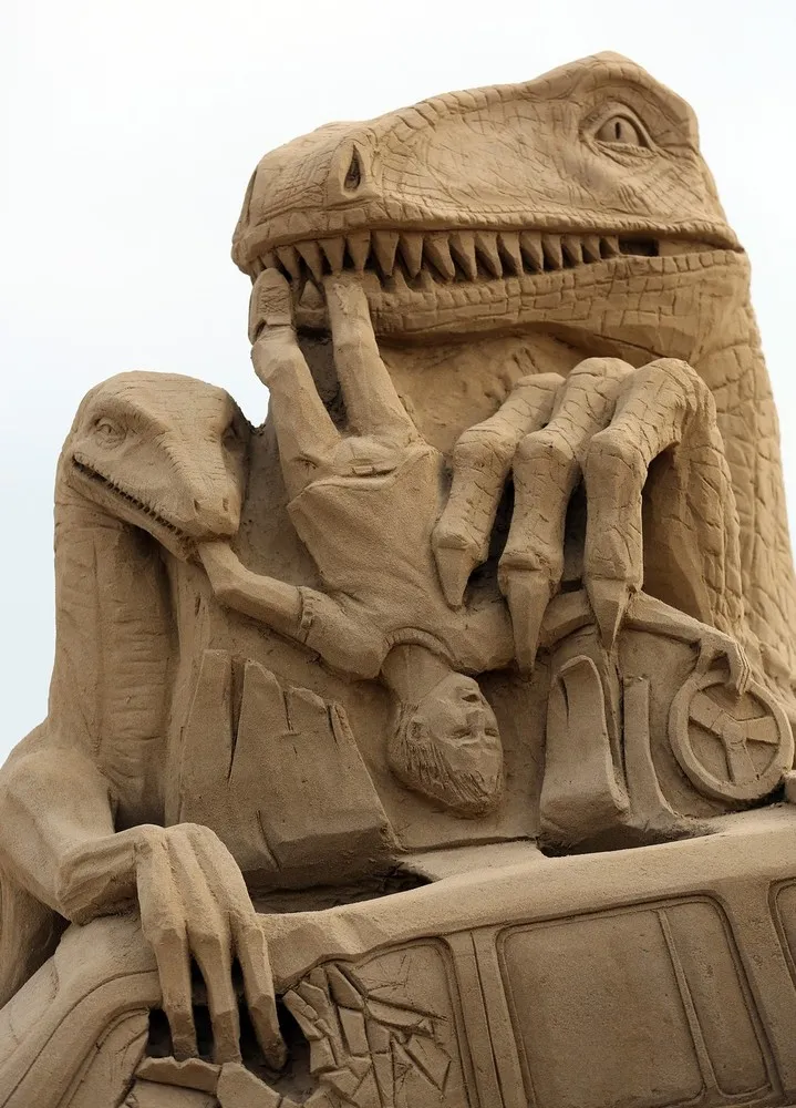 Sculptors Place the Finishing Touches to Their Hollywood Themed Sand Sculptures