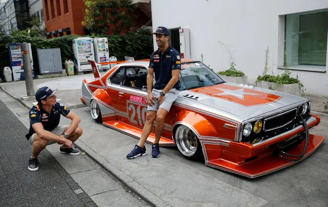 Red Bull Formula One driver Daniel Ricciardo (R) of Australia and Max Verstappen of the Netherlands pose with a 1979 Nissan Skyline in Tokyo, Japan ahead of weekend's Japanese F1 Grand Prix, October 5, 2016. (Photo by Toru Hanai/Reuters)