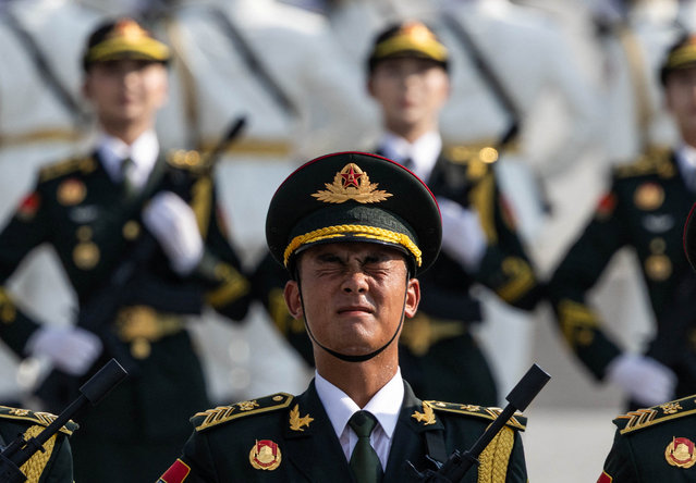 A soldier of the People's Liberation Army (PLA) of China reacts during training ahead of a military parade to mark the 80th anniversary of the end of World War Two, in Beijing, China, on August 20, 2025. (Photo by Maxim Shemetov/Reuters)