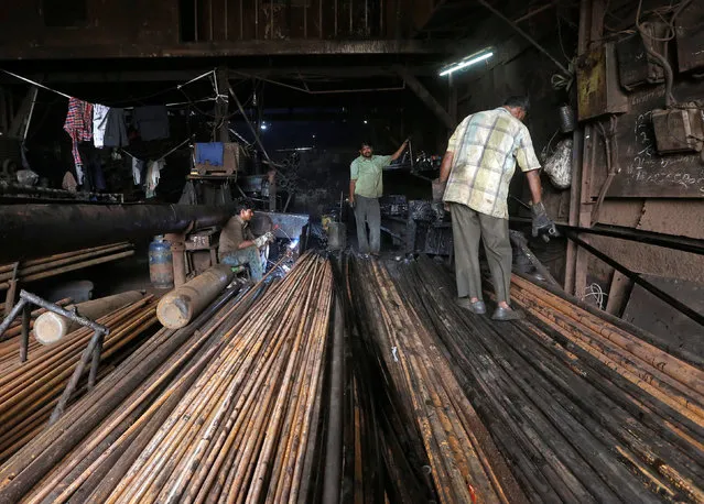 Workers weld pipes at a workshop in an industrial unit in Mumbai, India, October 10, 2016. (Photo by Shailesh Andrade/Reuters)