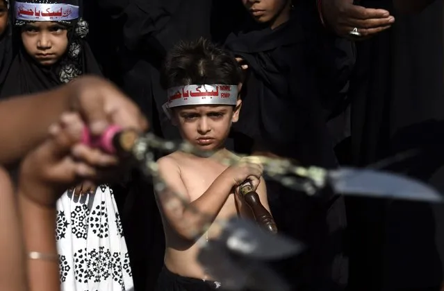 A Pakistani Shiite Muslim flagellates himself with chains and blades a day ahead of the commemoration of Ashura, in Islamabad, Pakistan, 11 October 2016. Shiite Muslims are observing the holy month of Muharam, the climax of which is the Ashura festival commemorating the martyrdom of Imam Hussein, a grandson of the Prophet Mohammed, in the Iraqi city of Karbala in the seventh century. (Photo by T. Mughal/EPA)