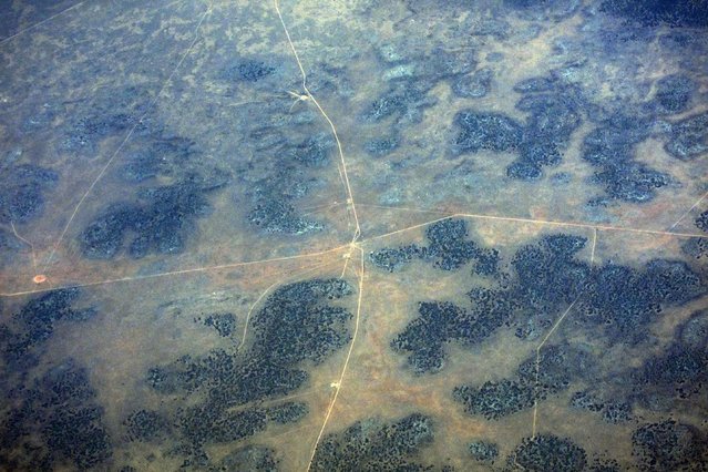 A small dam and roads can be seen in drought effected farmlands in outback Western Australia, November 12, 2015. (Photo by David Gray/Reuters)