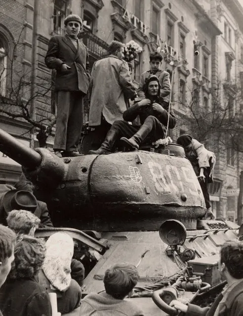 Fighters stand on top of a tank in Budapest at the time of the uprising against the Soviet-supported Hungarian communist regime in 1956. The picture was taken in the period between October 23 and November 4, 1956. (Photo by Laszlo Almasi/Reuters)