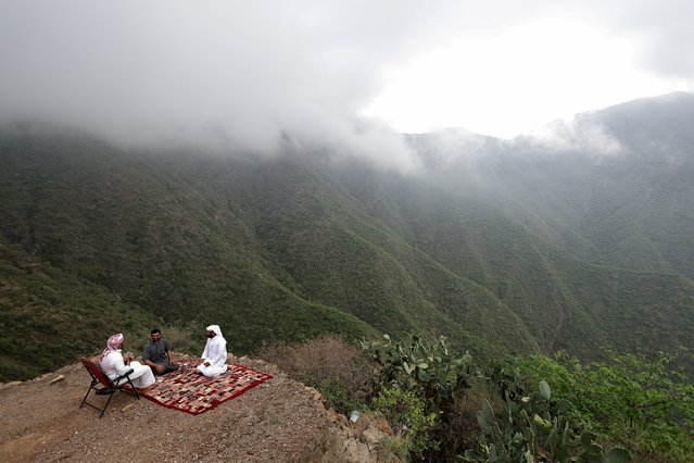 Saudi men have their afternoon tea amid cooler temperatures in the mountains of Rijal Almaa, Saudi Arabia, on August 20, 2025. (Photo by Hamad I Mohammed/Reuters)
