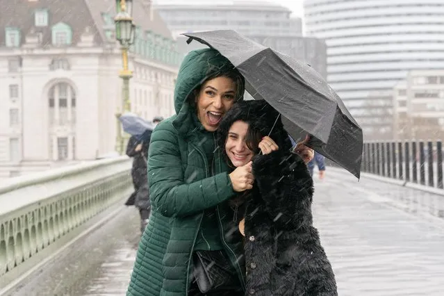 Glum weather but not faces on Westminster Bridge in London, United Kingdom on March 30, 2023. (Photo by Rick Findler/Story Picture Agency)