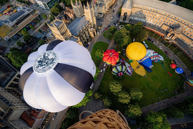Hot air balloons lift off on Wednesday, July 24, 2024 beside Bristol cathedral during a preview of the 46th Bristol International Balloon Fiesta, an annual four day free festival of hot air ballooning and the largest event of its kind in Europe, that is due to take between August 9 and 11 in Bristol. (Photo by Ben Birchall/PA Images via Getty Images)