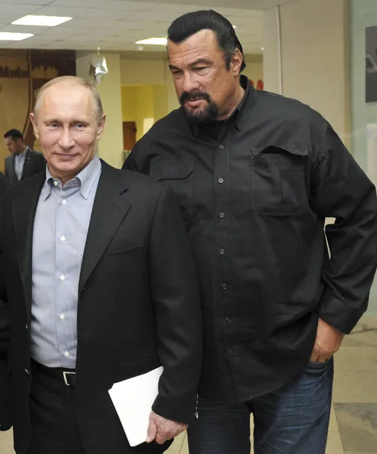 In this file photo taken on Wednesday, March 13, 2013, Russian President Vladimir Putin, left, and U.S. movie actor Steven Seagal visit a new sports arena in Moscow, Russia. file photo, Russian President Vladimir Putin, right, speaks with U.S. actor Steven Seagal in the Russian Far Eastern port of Vladivostok. Russian President Vladimir Putin has awarded Russian citizenship to action film actor Steven Seagal, the Kremlin said Thursday. November 3, 2016. ﻿The 64-year-old Seagal has been a regular visitor to Russia in recent years and has accompanied Putin to several martial arts events, as well as vocally defending the Russian leader's policies and criticizing the U.S. government. (Photo by Alexei Nikolsky/Sputnik, Kremlin File Pool Photo via AP Photo)