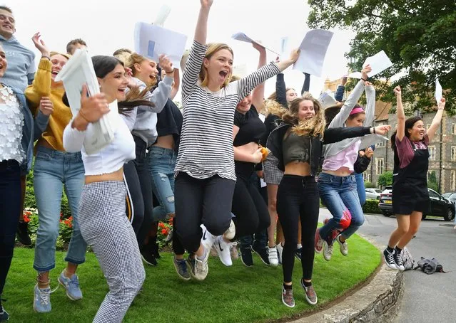 Students celebrate their A Level results at Brighton College in East Sussex, South East England on August 16, 2018. (Photo by Gareth Fuller/PA Images via Getty Images)