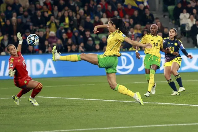 Colombia's Catalina Usme, right, scores her side's first goal during the Women's World Cup round of 16 soccer match between Jamaica and Colombia in Melbourne, Australia, Tuesday, August 8, 2023. (Photo by Hamish Blair/AP Photo)