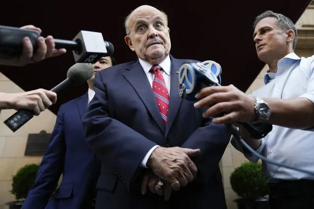 Former Mayor of New York Rudy Giuliani speaks to reporters as he leaves his apartment building in New York, Wednesday, August 23, 2023. (Photo by Seth Wenig/AP Photo)