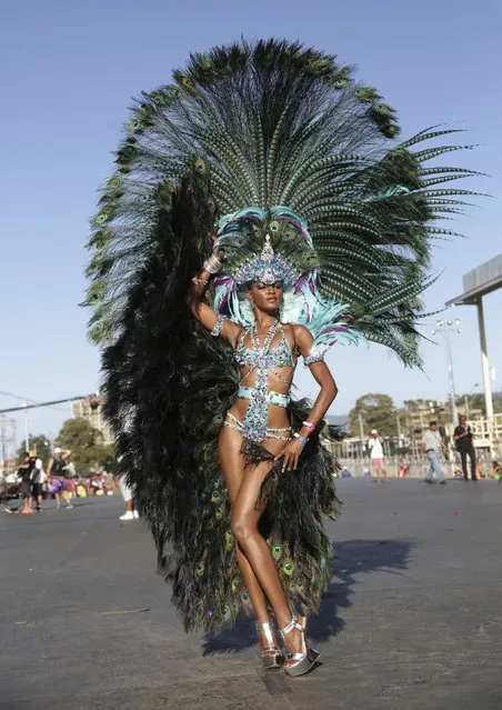 Trinidadian model Soowan Bramble parades on stage with Hart's band “Dominion Of The Sun” during the band's presentation at Queen's Park Savannah, Port-of-Spain on February 17, 2015. (Photo by Andrea De Silva/Reuters)