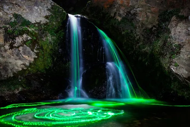 The otherworldy images are created by clever use of long exposure photography and glow sticks floating through water. (Photo by Sean Lenz/Kristoffer Abildgaard)