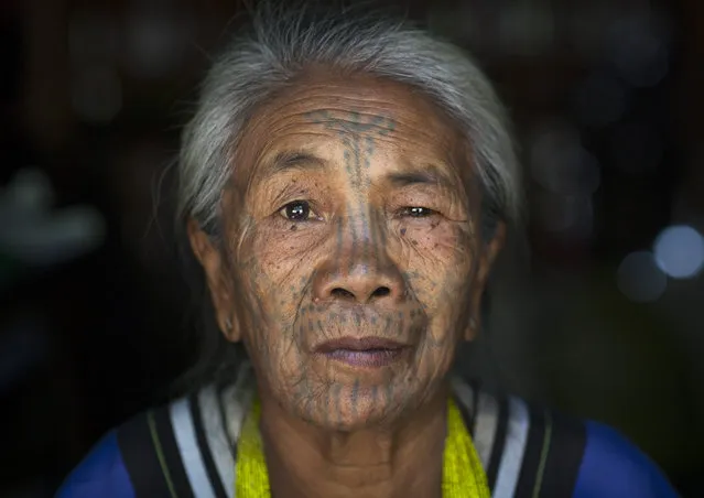 A woman from the Muun tribe who inhabit the hills of the Arakan state. The design, known as the letter B-pattern, is common in the Mindat area. It is composed of dots, lines and occasionally circles, in February, 2015, in Myanmar, Burma. (Photo by Eric Lafforgue/Barcroft Media)