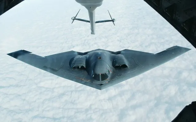 A Northrop Grumman B-2 Spirit stealth bomber approaches an U.S. Air Force KC-10(A) tanker plane over the Missouri sky to receive an aerial refueling after taking off from the Whiteman Air Force Base in Johnson County, Missouri in this October 30, 2002 file photo. The U.S. Government Accountability Office (GAO) on February 16, 2016 rejected a protest filed by Boeing Co and Lockheed Martin Corp against a multibillion-dollar bomber contract awarded to Northrop Grumman Corp  by the U.S. Air Force in October. (Photo by Hyungwon Kang/Reuters)