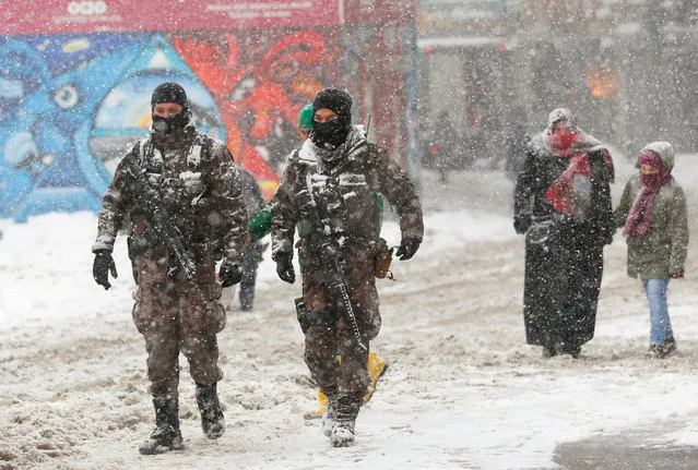 Members of police special forces patrol at the main shopping and pedestrian street of Istiklal during a snowfall in central Istanbul, Turkey January 9, 2017. (Photo by Murad Sezer/Reuters)