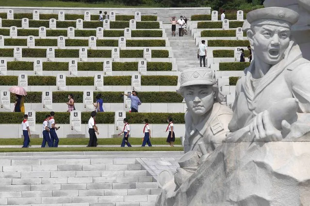 Pyongyang citizens visit the Fatherland Liberation War Martyrs Cemetery in Pyongyang, North Korea, Tuesday, July 27, 2021 to mark the Korean War armistice anniversary. (Photo by Jon Chol Jin/AP Photo)