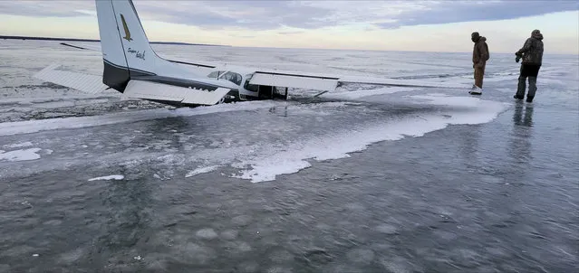 This December 19, 2023 photo provided by the Beltrami County Sheriff's Office in Minnesota shows a plane that fell through ice on Upper Red Lake in Washkish, Minn. (Photo by Beltrami County Sheriff's Office via AP Photo)