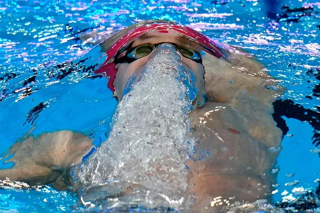 Roman Mityukov of Switzerland competes in the men's 200-meter backstroke heat at the World Aquatics Championships in Doha, Qatar, Thursday, February 15, 2024. (Photo by Hassan Ammar/AP Photo)