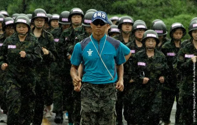 South Korean teenagers participate in a warfare exercise as part of the Special Warfare Command's training course at a military base