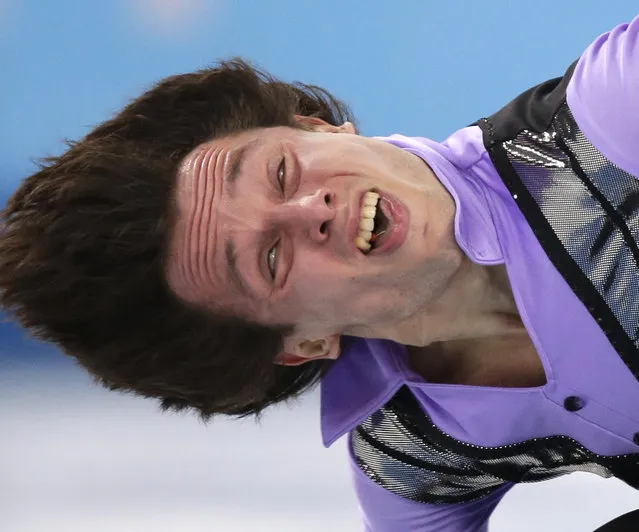 Alexei Bychenko of Israel competes in the men's short program figure skating competition at the Iceberg Skating Palace during the 2014 Winter Olympics, Thursday, February 13, 2014, in Sochi, Russia. (Photo by Bernat Armangue/AP Photo)
