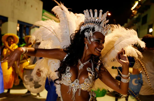 A member of a comparsa, a Uruguayan carnival group, dances during the Llamadas parade, a street fiesta with traditional Afro-Uruguayan roots, in Montevideo February 10, 2017. (Photo by Andres Stapff/Reuters)