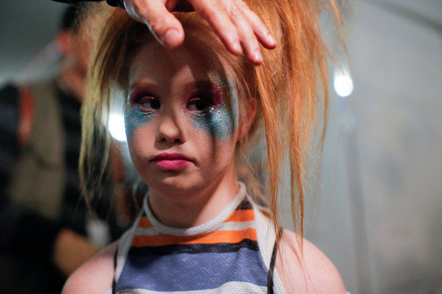 Australian model and designer Madeline Stuart, who has Down syndrome, is prepared backstage before presenting creations from her label 21 Reasons Why By Madeline Stuart during New York Fashion Week in Manhattan, New York, U.S., February 12, 2017. (Photo by Andrew Kelly/Reuters)