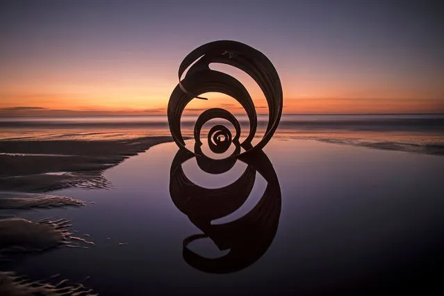 The sun sets behind the semi-submerged Mary's Shell sculpture on Cleveleys Beach, January 4, 2017 in Blackpool, England. Mary's shell is an installation of public art on Cleveleys Beach, Lancashire, and created by artist and sculptor Stephen Broadbent. (Photo by Christopher Furlong/Getty Images)
