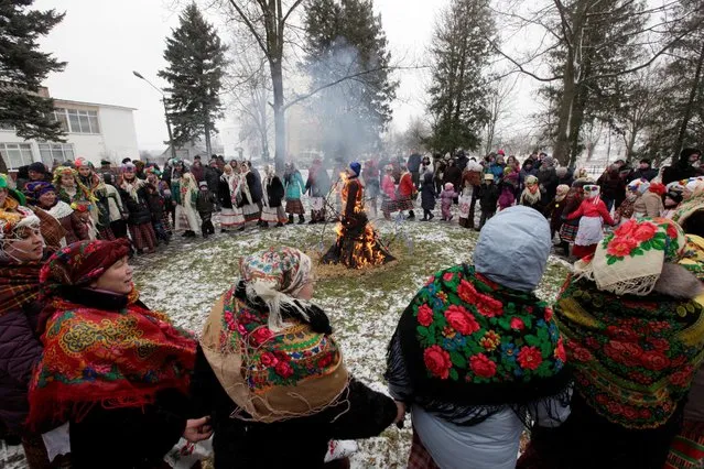 Villagers take part in a festive game during celebration of Maslenitsa, or Pancake Week, in the Rachen village, Belarus, February 26, 2017. (Photo by Vasily Fedosenko/Reuters)